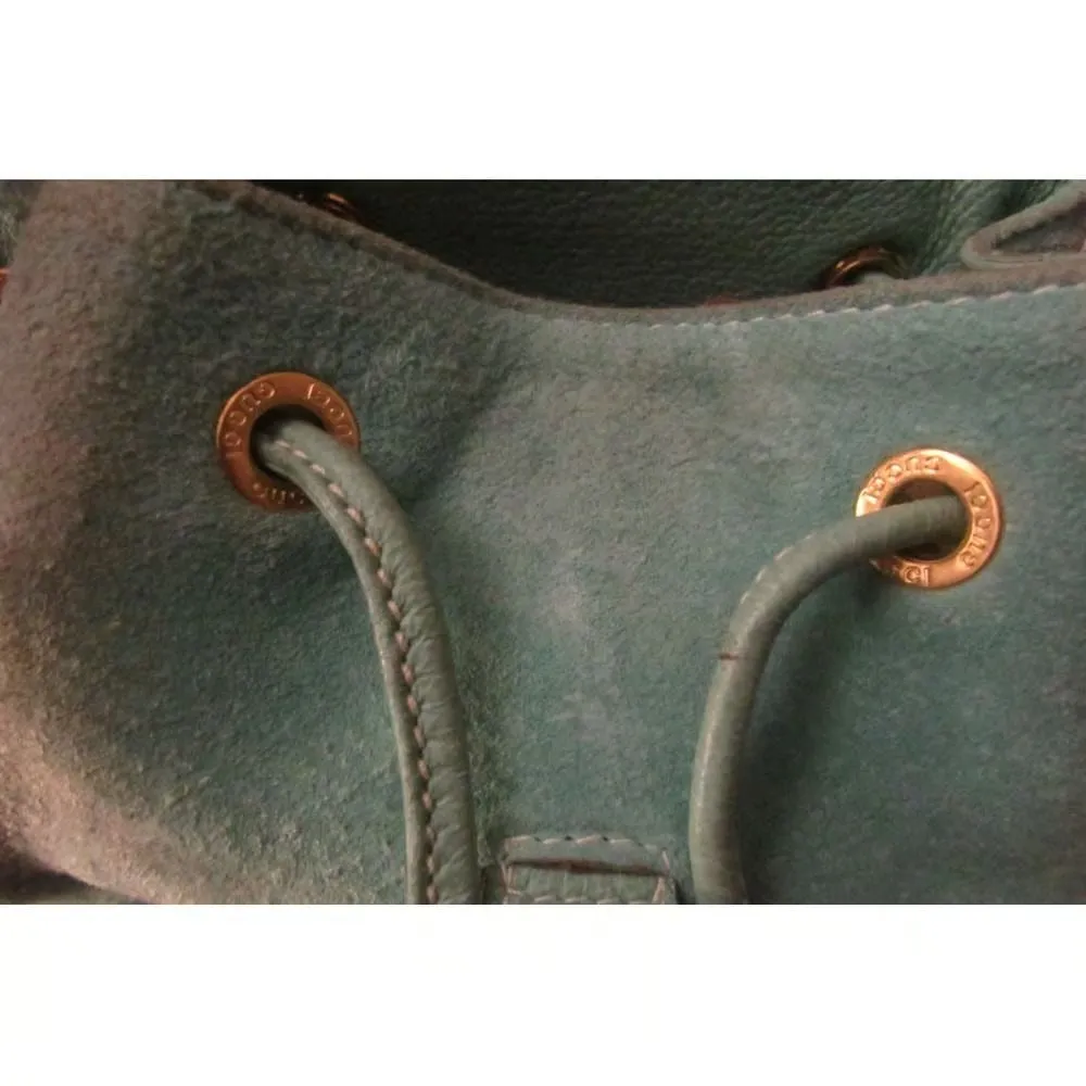 Tom Ford era, Gucci, aqua color, suede and leather, messenger bag/backpack with an exterior pocket, drawstring top closure