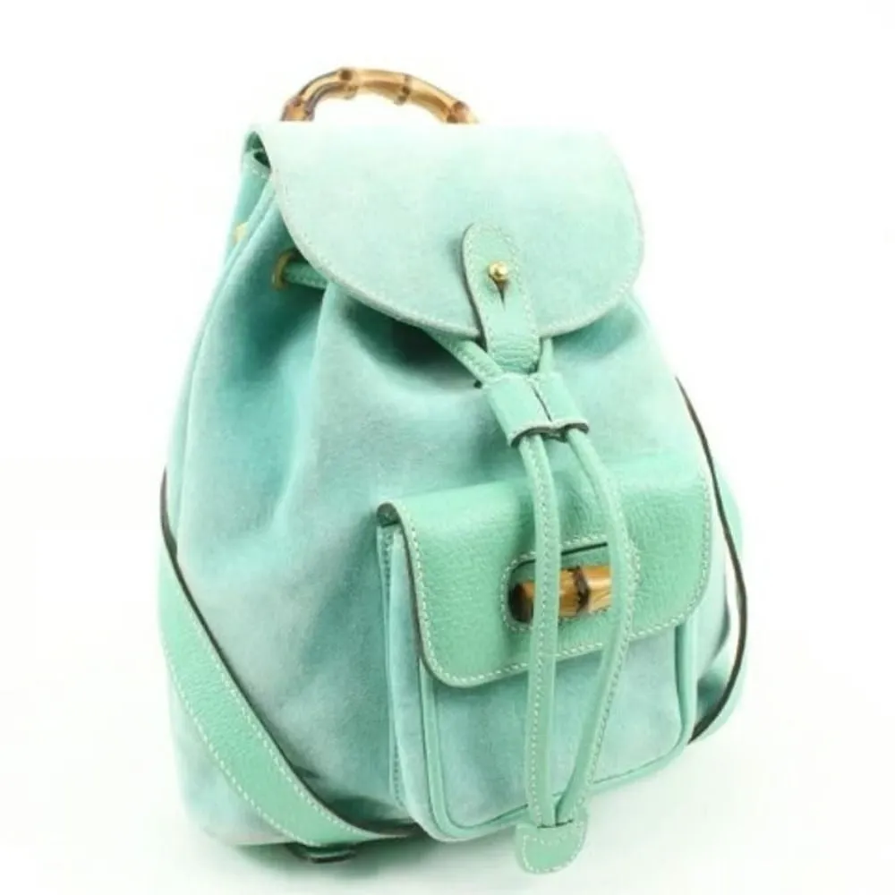 Tom Ford era, Gucci, aqua color, suede and leather, messenger bag/backpack with an exterior pocket, drawstring top closure