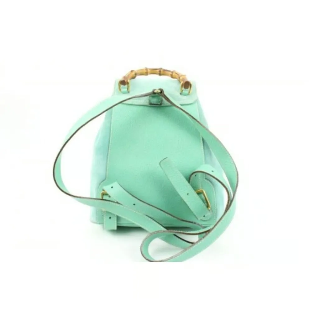 Tom Ford era, Gucci, aqua color, suede and leather, messenger bag/backpack with an exterior pocket, drawstring top closure