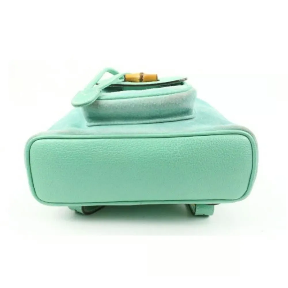 Tom Ford era, Gucci, aqua color, suede and leather, messenger bag/backpack with an exterior pocket, drawstring top closure