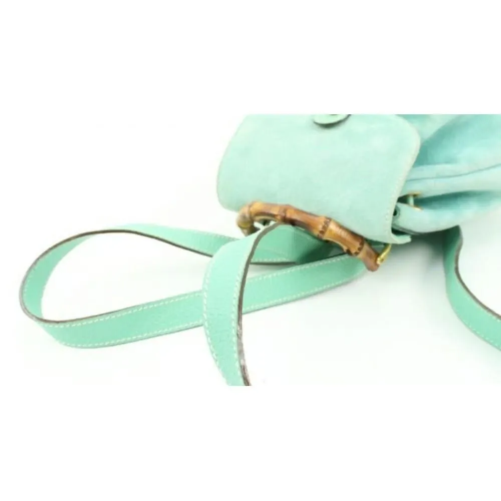 Tom Ford era, Gucci, aqua color, suede and leather, messenger bag/backpack with an exterior pocket, drawstring top closure