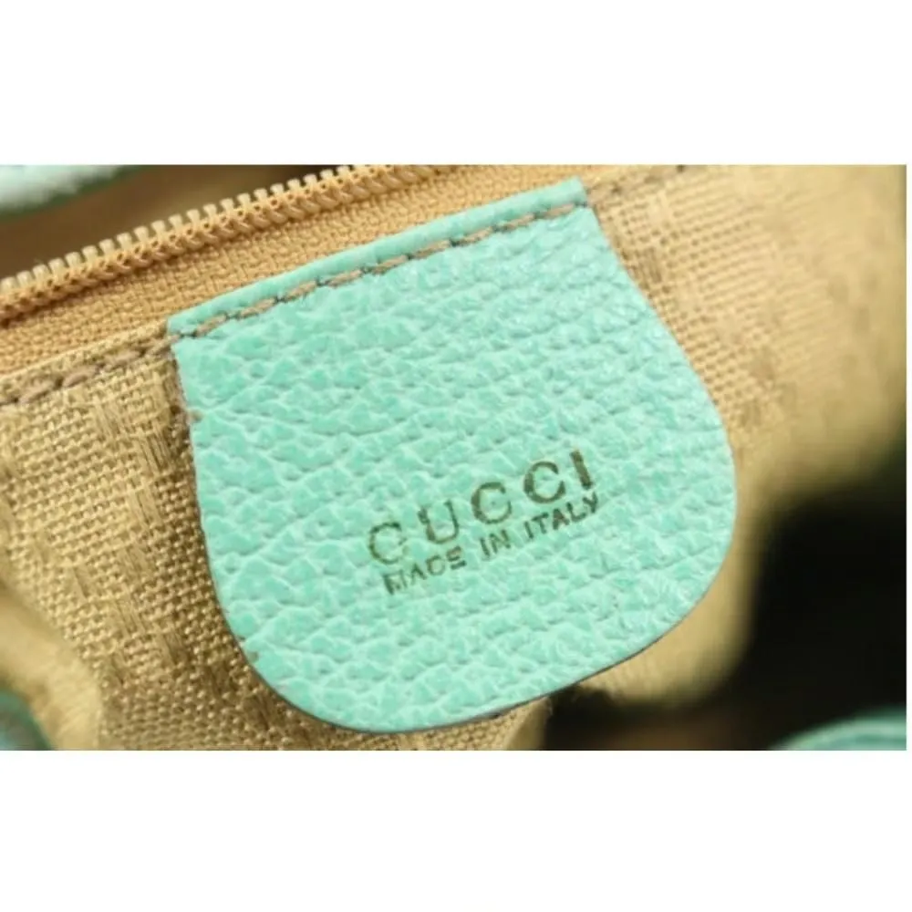 Tom Ford era, Gucci, aqua color, suede and leather, messenger bag/backpack with an exterior pocket, drawstring top closure